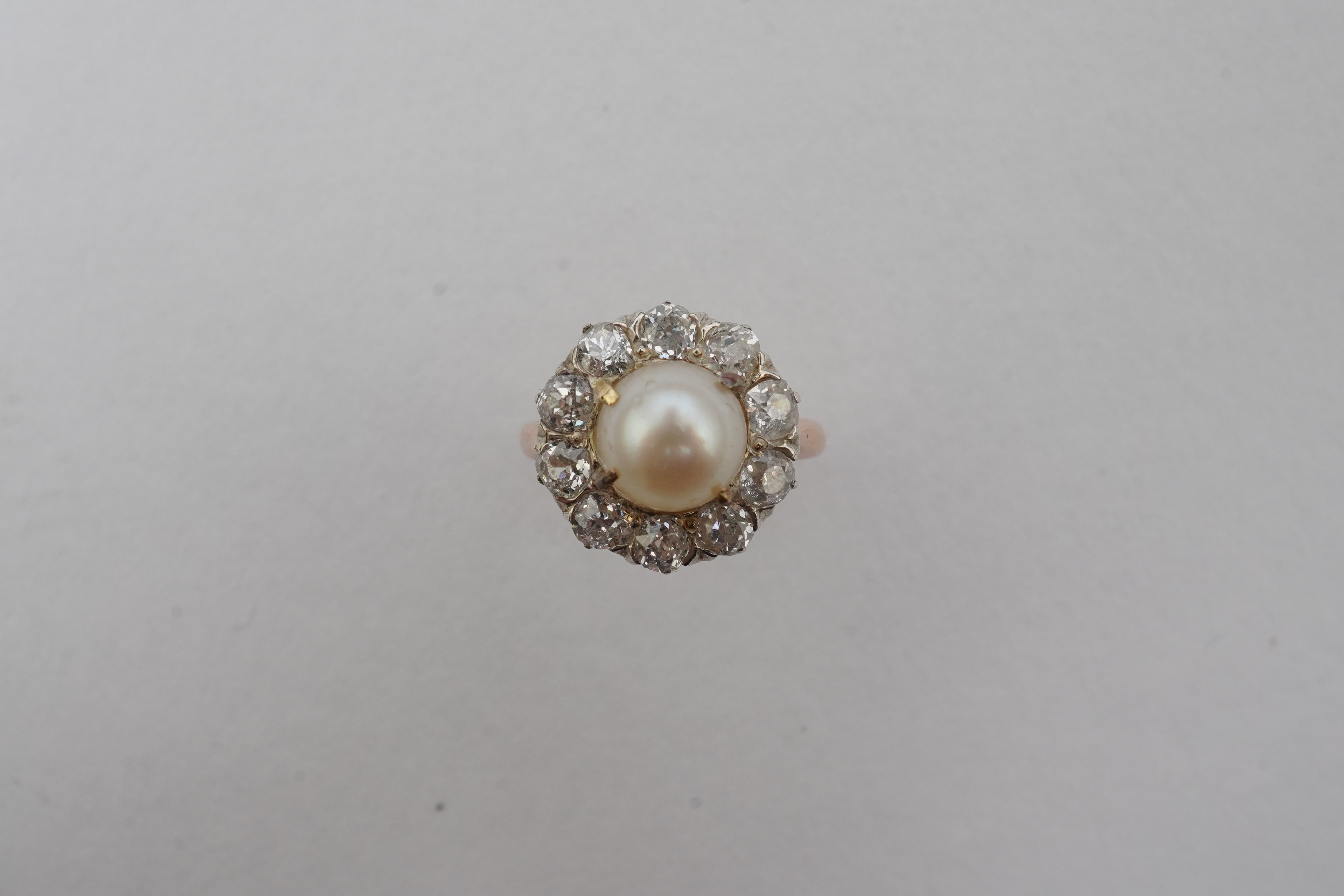 A cultured pearl and diamond ring
